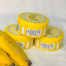 Adeus Banana Cream lightening dark spots on face and body, 100g, with natural banana extract for skin brightening.