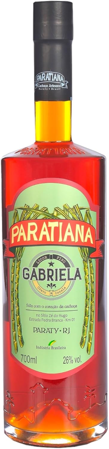 Gabriela Paratiana Cachaça Liqueur bottle, 700ml, with a clear glass bottle and colorful label, on a wooden surface