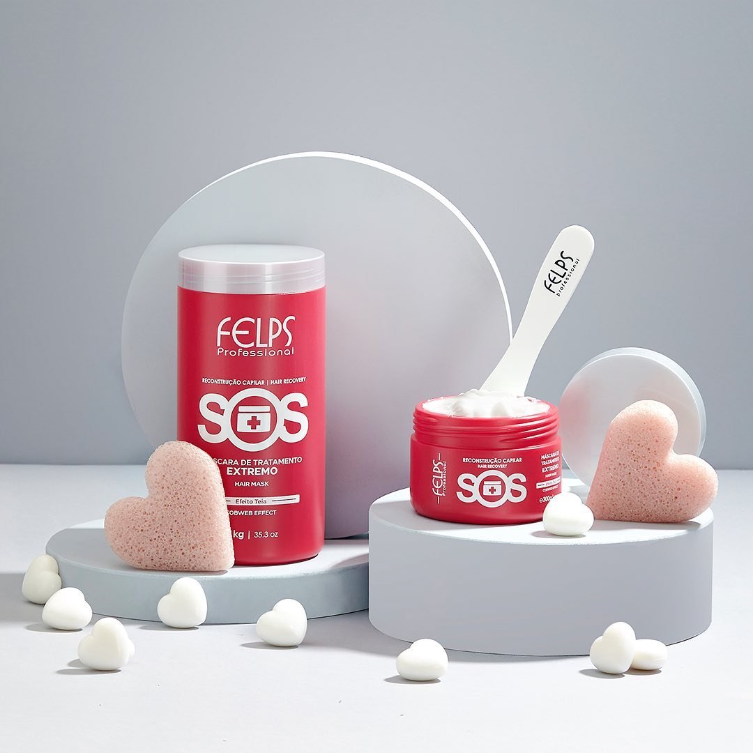 FELPS SOS Hair Reconstruction Mask 1kg jar for deep conditioning and repair of damaged hair, in natural hair care setting.